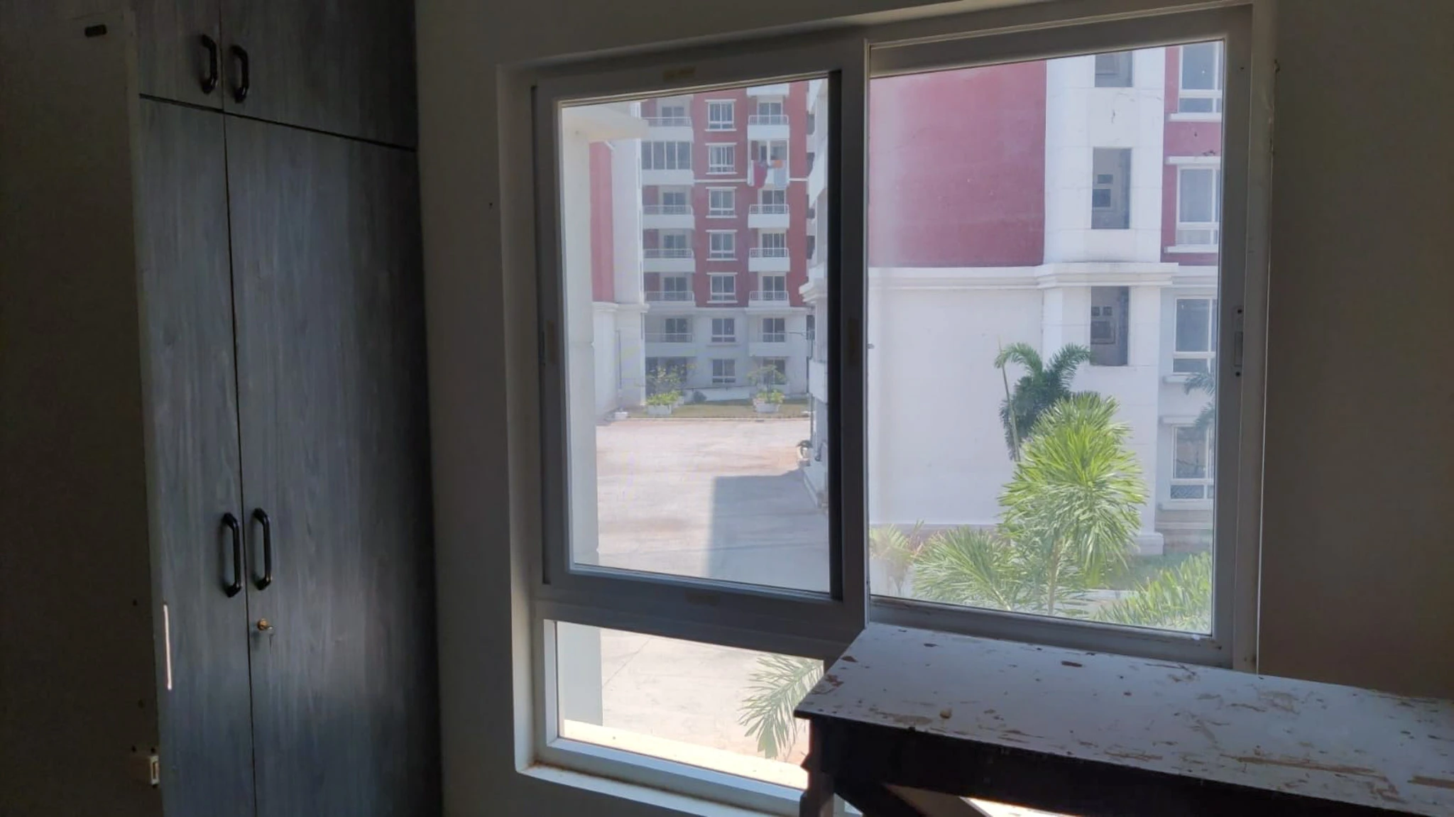 Flat G-102, 1st Floor, G Block, Kaveri Apartment, Zuari Garden City, Srirangapatna Taluk, Mandya District. Super built-up area: 150.97 sqm (1625 sqft). Undivided share: 56.11 sqm. One car parking. Bounded on East by Open Space, West by Flat G-103, North by Open Space, South by Flat G-101.