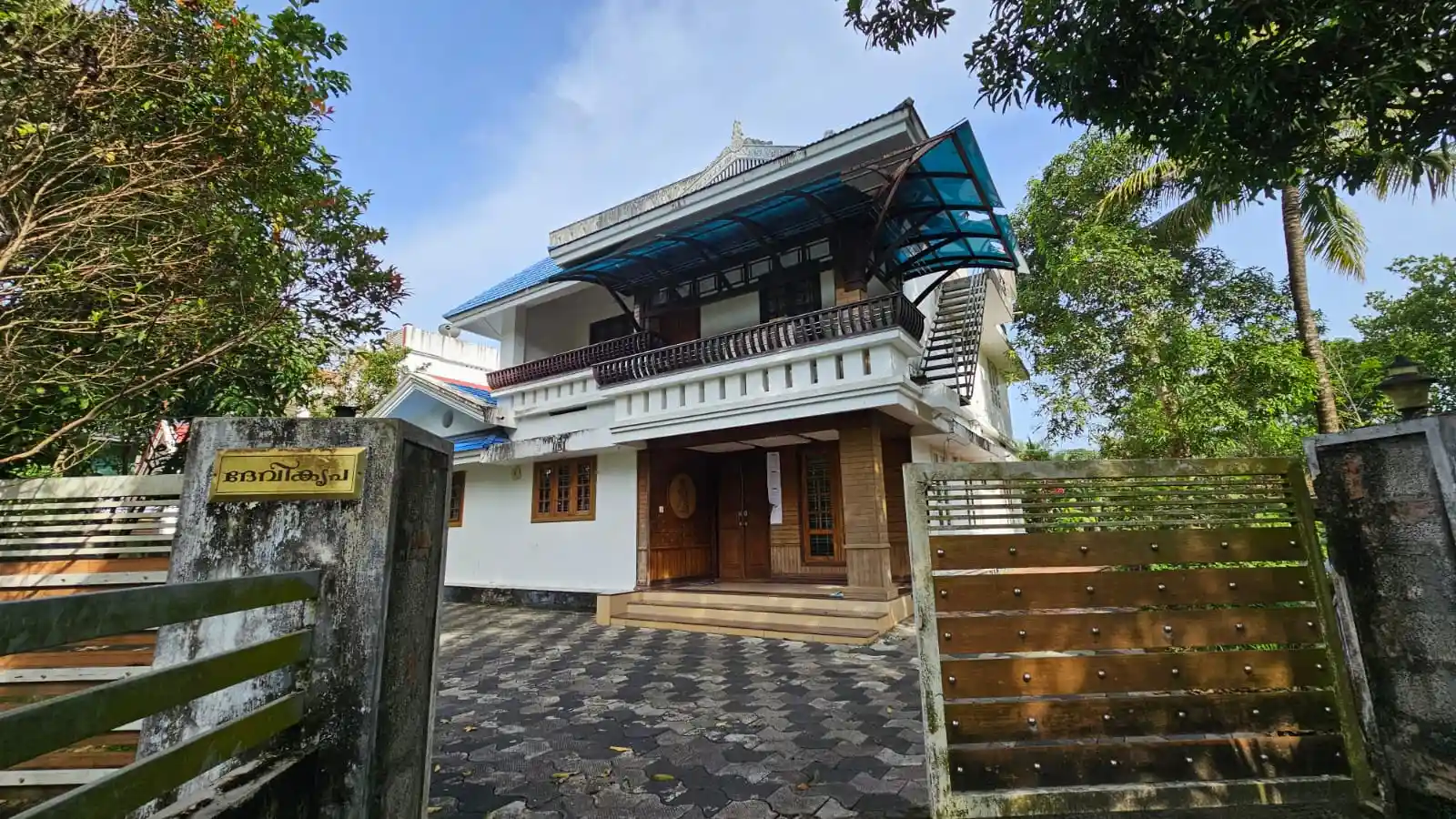 12.14 Ares of residential land and building in the name of Late Mr. Aravindakshan in Re. survey no.72/2 Block no.8, Chengamanad Village Aluva Taluk, Ernakulam District located with two storied building plinth area of 254.00 m2 at Aluva, Ernakulam district within the specific four boundaries of: East – Property of Sri Ashokan, South – Temple property, West – Property of Mrs. Saraswathy Amma, North – Road