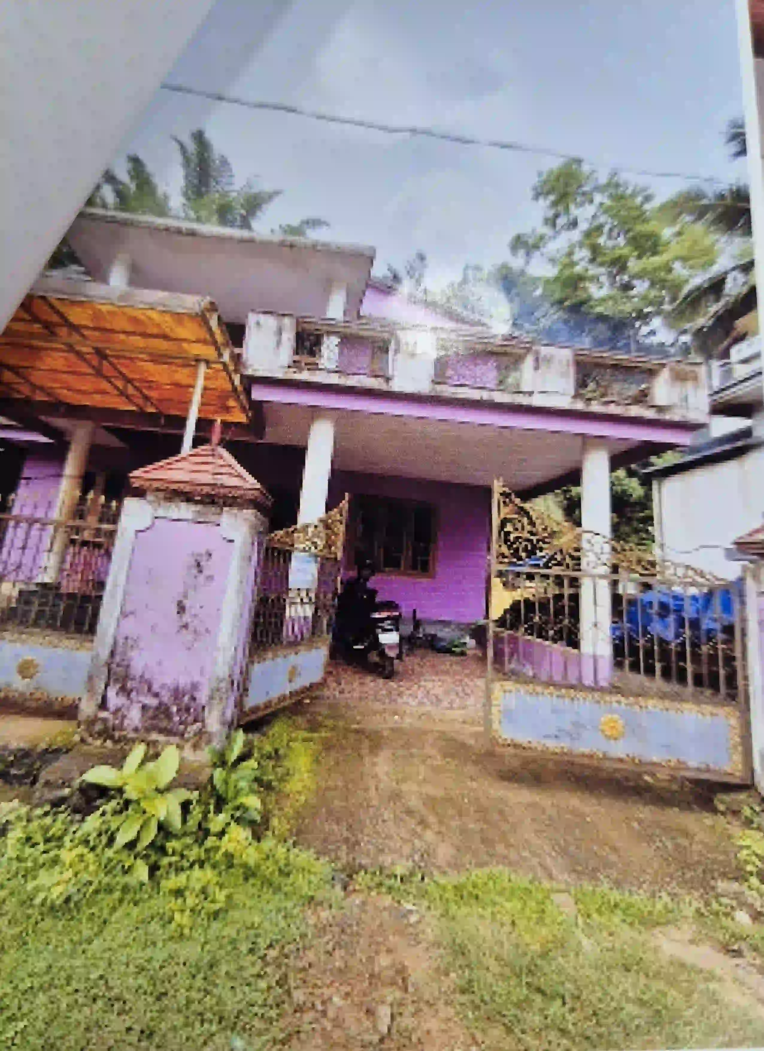 Land with building thereon in Killimangalam village of Thalappilly Taluk, Thrissur District with following boundaries: North: PWD Road, South: Property of Kadeeja Umma, East : Vazhy, West: Property of Ummer