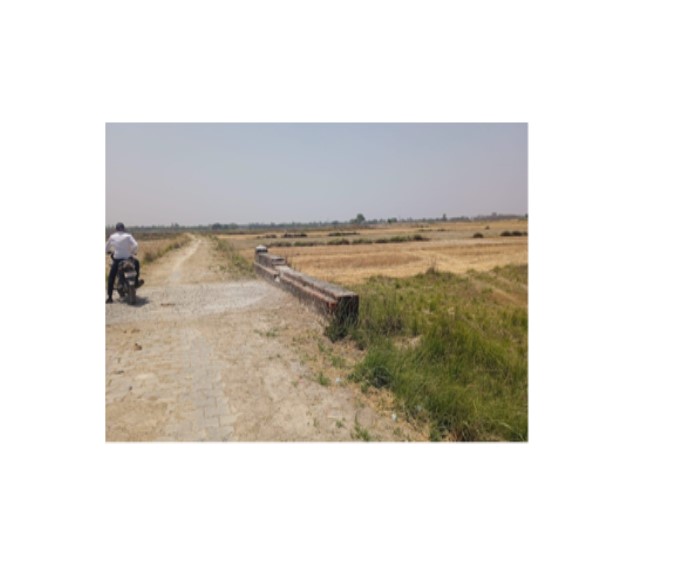 Agricultural land with an area of 0.107 Hect under Arazi no.234 at Mauza Masanpakar, Tappa Rampur Kotha, Pargana Bhauapar, Tehsil Bansgaon, District Gorakhpur. Boundaries: East - Field of Man Singh, West - Field of Rama Shankar Singh, North- Field of Dharmendra Singh, South- Road